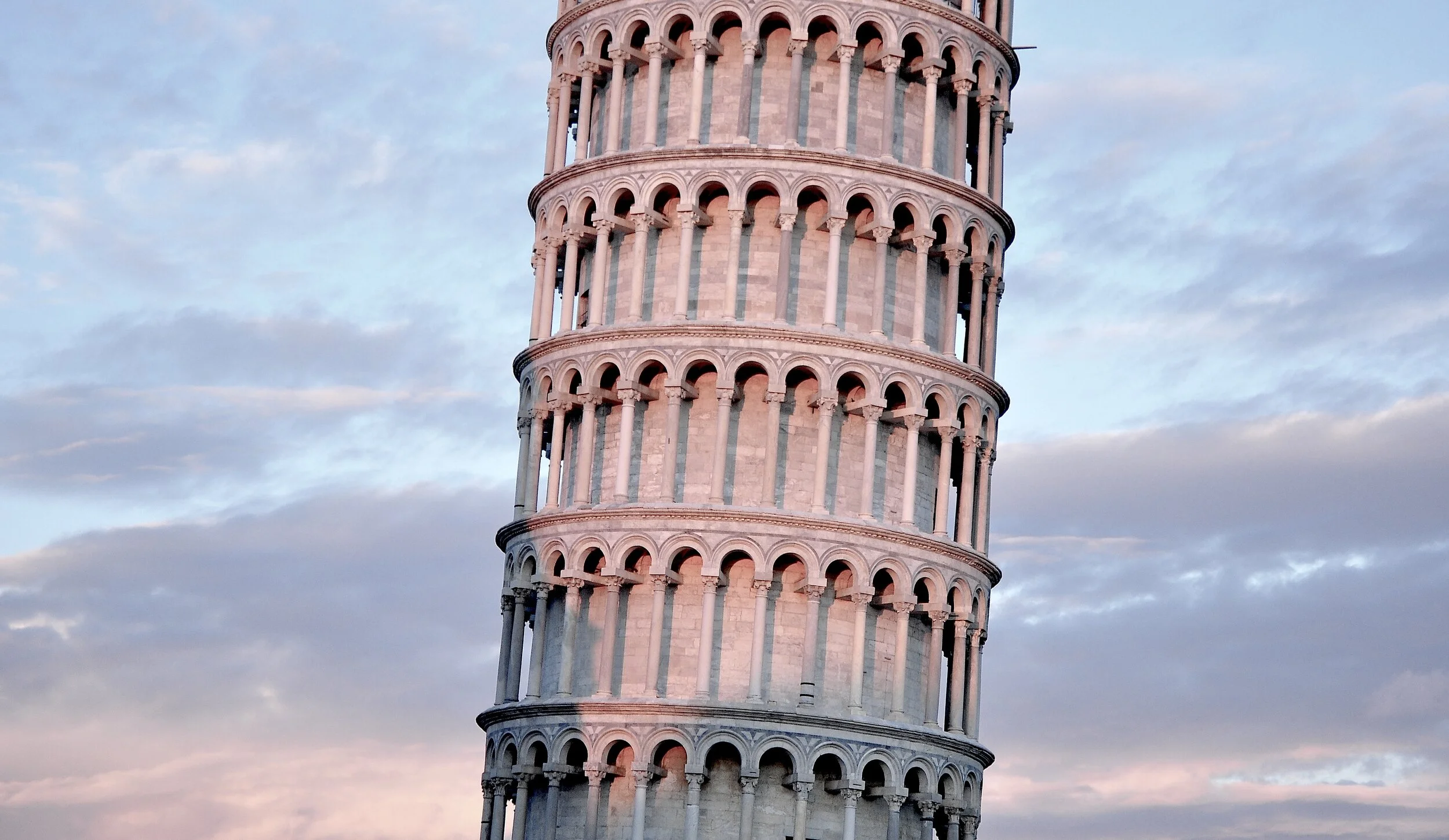 Leaning Tower of Pisa against a cloudy sky